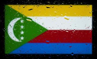 Drops of water on comoros flag background. Shallow depth of field. Selective focus. Toned. photo