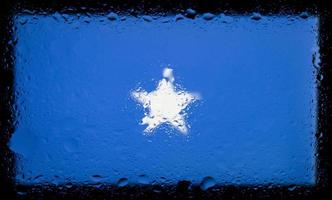 Drops of water on Somalia flag background. Shallow depth of field. Selective focus. Toned. photo