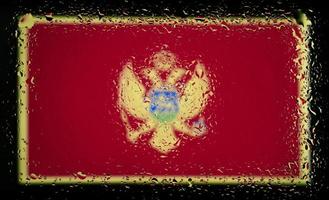 Drops of water on MONTENEGRO flag background. Shallow depth of field. Selective focus. Toned. photo