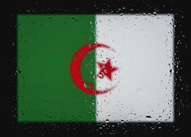 Drops of water on Algeria flag background. Shallow depth of field. Selective focus. Toned. photo
