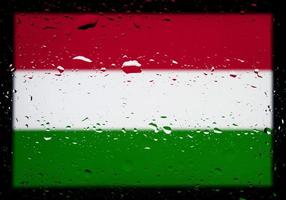 Drops of water on Hungary flag background. Shallow depth of field. Selective focus. Toned. photo