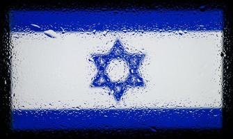 Drops of water on Israel flag background. Shallow depth of field. Selective focus. Toned. photo