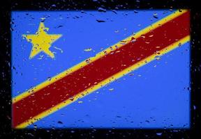 Drops of water on Congo Kinshasa flag background. Shallow depth of field. Selective focus. Toned. photo