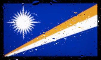 Drops of water on Marshall Islands flag background. Shallow depth of field. Selective focus. Toned. photo