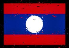 Drops of water on Laos flag background. Shallow depth of field. Selective focus. Toned. photo