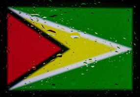 Drops of water on Guyana flag background. Shallow depth of field. Selective focus. Toned. photo