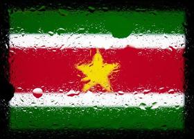 Drops of water on Suriname flag background. Shallow depth of field. Selective focus. Toned. photo