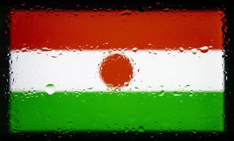 Drops of water on Niger flag background. Shallow depth of field. Selective focus. Toned. photo