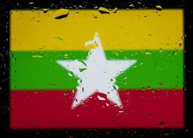 Drops of water on myanmar flag background. Shallow depth of field. Selective focus. Toned. photo