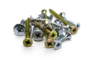 Metal screws, various sizes and views, with different lengths and threads, isolated on a white background. photo