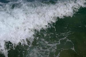 Texture of a foamy wave photo