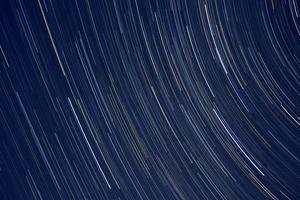 Star trails, vision of the stars that rotate in the firmament photo