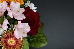 Bright spring flowers, composition on black background. photo