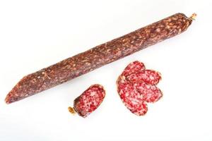 Dried Sausage on a Light Background photo