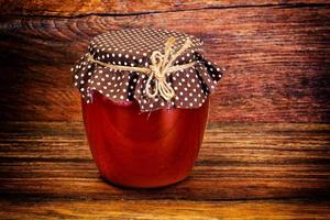 Glass Jar with Cream Honey Bee photo