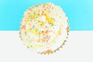 Cake with Cream, Cupcake on Blue Background. photo