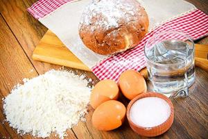 Bread, flour, egg, water. Baking photo