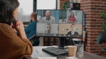 Woman attending business meeting on video call