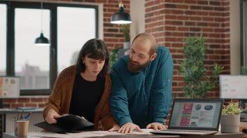 Man and woman doing teamwork to plan business project video