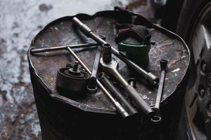 Wrench hanging on the mechanic's table in the garage. photo