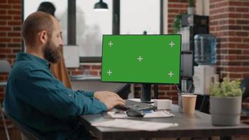Entrepreneur working with green screen on computer video