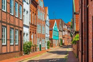 View of a typical German street with brick and half-timbered houses photo