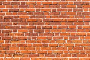 Red brick wall background, vintage brickwork texture photo