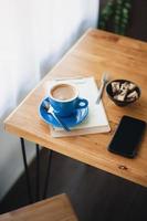 Hot coffee on table with abstract emotion photo