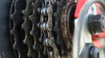 Close-up of a rear set of gear shifting sprockets on the rear wheel of a modern mountain bike with chain. Bicycle repair. photo
