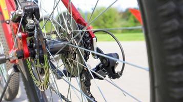 Close-up of a rear set of gear shifting sprockets on the rear wheel of a modern mountain bike with chain. Bicycle repair. photo