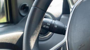 Detailing the car. Close-up of the left arm of the car turn signal. Gearshift light in the interior of the car. photo