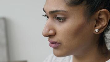 Close up of woman with eyes focused on screen video