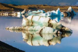 Jokulsarlon lagoon with blue sky floating iceberg photo