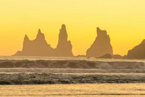 Landscape of Vik coast at sunset photo