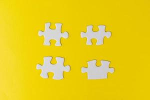 Pieces of white jigsaw puzzle photo