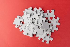 Stack of white jigsaw puzzle photo