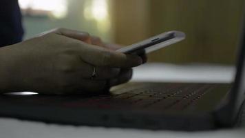 Hands of woman using smart phone for communication and chatting with social online on the bed at home. video