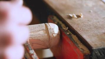 Woodcarver carves a helmet video