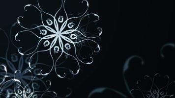 Glühen Bokeh Schneeflocken fließen auf schwarzem Hintergrund. video