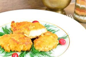 Breaded Chicken Fillet with Herbs and Cranberries. photo