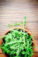 Arugula on Dark Woody Background photo