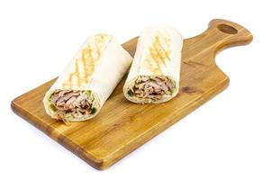 Shawarma, lavash with meat and vegetables. Photo