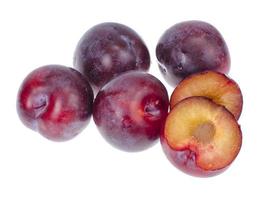 Ripe round sweet plum on white background photo