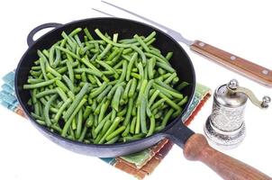 Green fresh green beans in frying pan