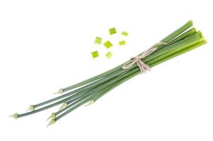 Fresh cut green onion arrows isolated on white photo