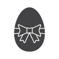 Easter egg glyph icon. Silhouette symbol. Easter egg with bow and ribbon. Negative space. Vector isolated illustration