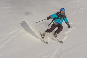 Grandvalira, Andorra, Jan 03, 2021 - Young man skiing in the Pyrenees at the Grandvalira ski resort photo