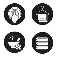 Spa salon icons set. Hand with manicure, mortar and pestle, clean spa salon towels on clothes hanger. Vector white silhouettes illustrations in black circles