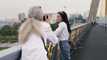 Women enjoying traveling and taking pictures with a camera