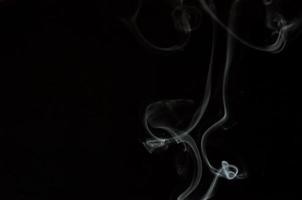 White smoke on a black background photo